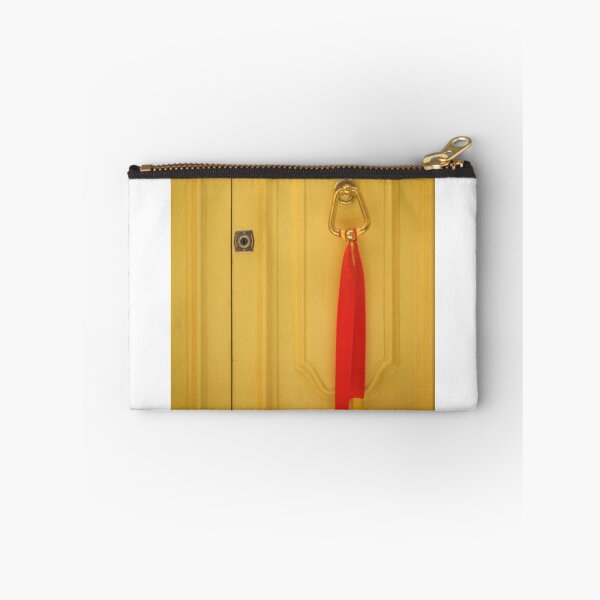 Item preview, Yellow Wooden Door With Brass Knocker And Red Ribbon Decoration On Vintage Entrance designed and sold by Nmallia.