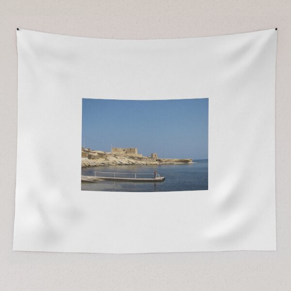 Item preview, Solitary Man On Pier Near Historic Coastal Fort Over Calm Mediterranean Sea On Sunny Day designed and sold by Nmallia.