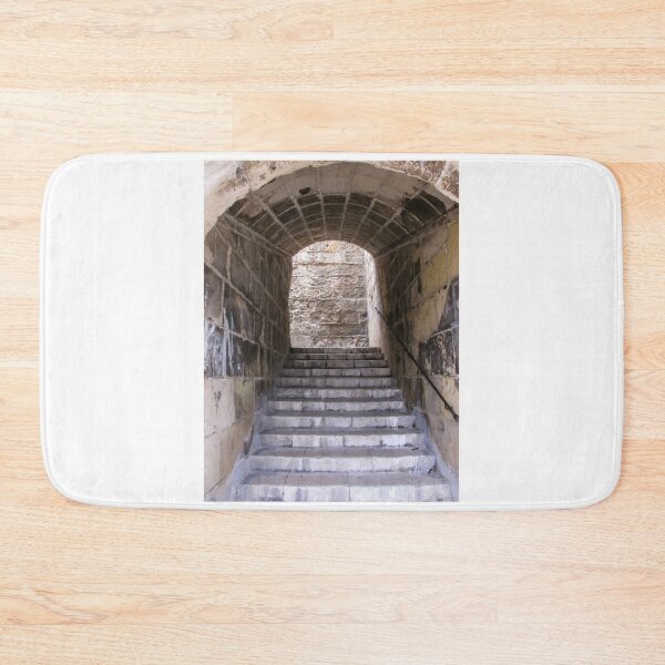 Item preview, Stone Staircase Leading Through Arched Tunnel Toward Light in Historic Fortress Passage designed and sold by Nmallia.