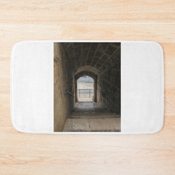 Item preview, Stone Staircase Leading Through Arched Tunnel Toward Light in Historic Fortress Passage designed and sold by Nmallia.