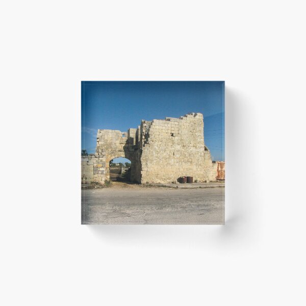 Item preview, Old Stone Ruins With Archway and Rusted Gate Beside Road Under Blue Sky designed and sold by Nmallia.