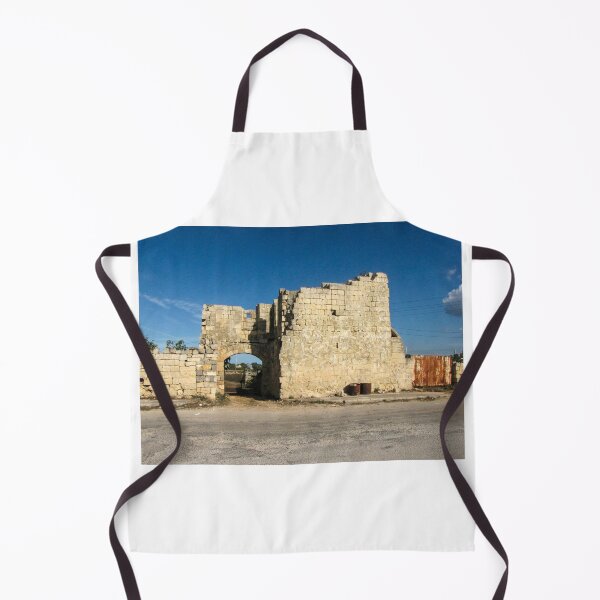 Item preview, Old Stone Ruins With Archway and Rusted Gate Beside Road Under Blue Sky designed and sold by Nmallia.