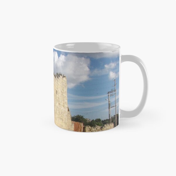 Item preview, Old Stone Ruins With Archway and Rusted Gate Beside Road Under Blue Sky designed and sold by Nmallia.