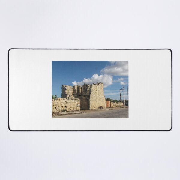 Item preview, Old Stone Ruins With Archway and Rusted Gate Beside Road Under Blue Sky designed and sold by Nmallia.