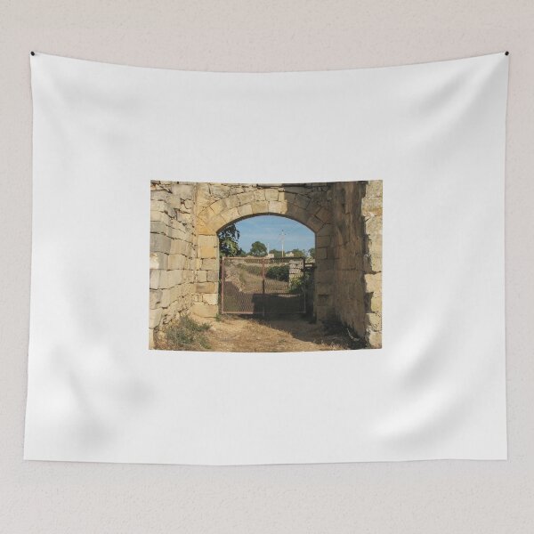 Item preview, Old Stone Archway With Rusty Metal Gate Framing a Rural Path and Sunlit Countryside designed and sold by Nmallia.