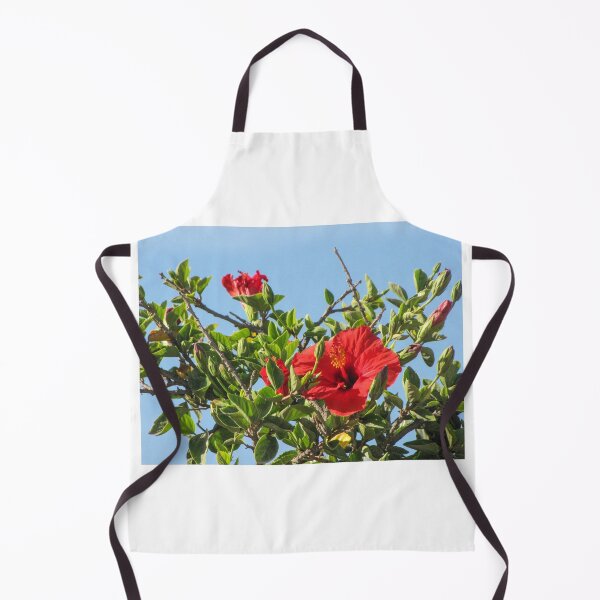 Item preview, Vibrant Red Hibiscus Blossom On Green Shrub Branches Against Clear Blue Sky Close-Up designed and sold by Nmallia.