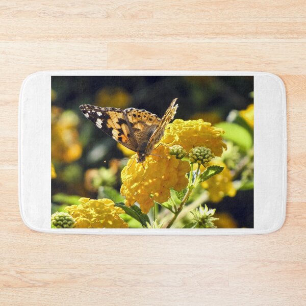 Item preview, Yellow Butterfly Feeding on Vibrant Lantana Flowers in a Sunlit Garden Macro Close-Up  designed and sold by Nmallia.