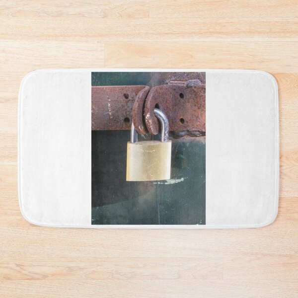 Item preview, Brass Padlock Securing Rusty Metal Hasp on Weathered Green Door, Security and Protection Concept designed and sold by Nmallia.