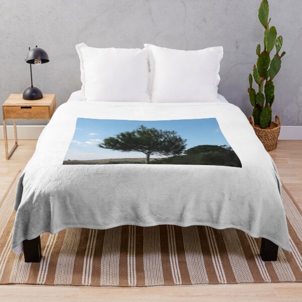 Item preview, Solitary Pine Tree On Rolling Hill With Clear Blue Sky And Countryside View designed and sold by Nmallia.