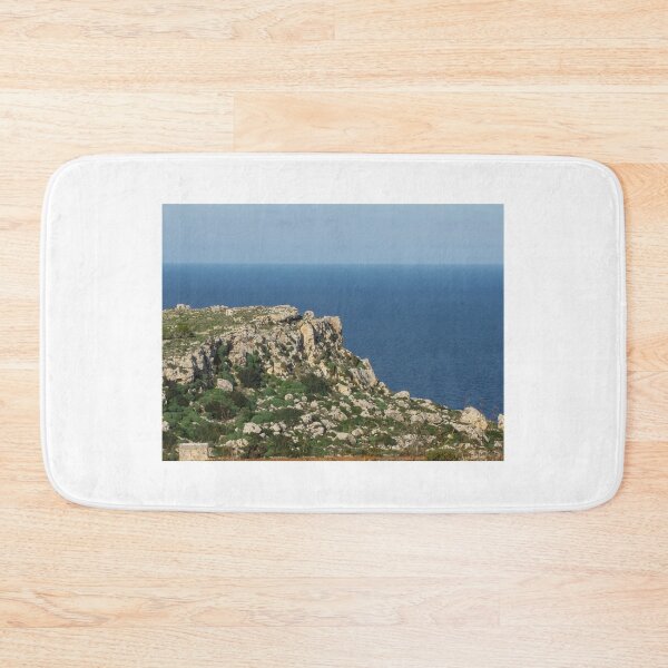 Item preview, Rocky Coastal Cliff Overlooking Calm Blue Sea With Mediterranean Shrubland And Distant Horizon designed and sold by Nmallia.