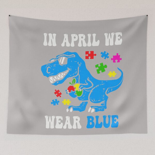 Item preview, in April We Wear Blue Autism Awareness Dino T-Rex Dinosaur designed and sold by GreggRoss.