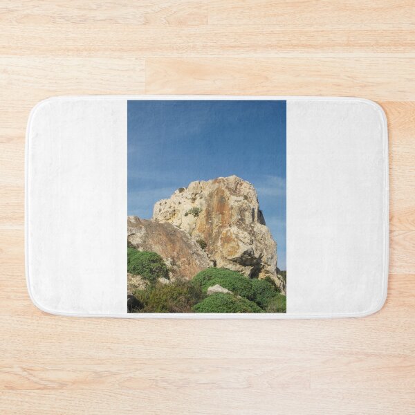 Item preview, Eroded Limestone Rock Formation in Rugged Mediterranean Landscape With Blue Sky and Coastal Vegetation designed and sold by Nmallia.