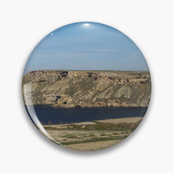 Item preview, Rocky Coastal Cliffs Overlooking A Calm Blue Bay With Farmland And Clear Sky designed and sold by Nmallia.