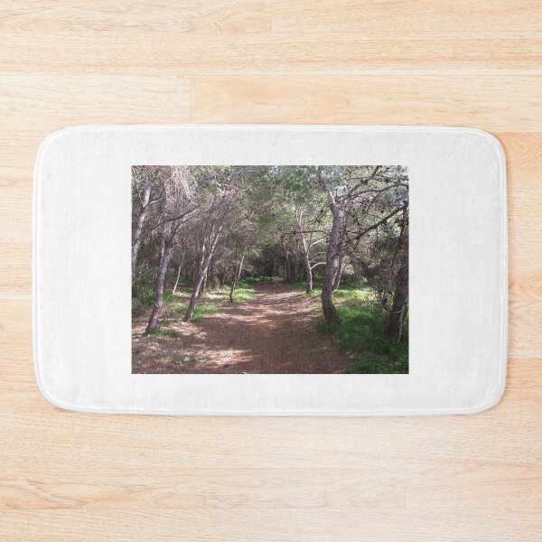 Item preview, Sunlit Forest Path Through Pine Trees And Shaded Woodland Trail With Natural Green Undergrowth designed and sold by Nmallia.