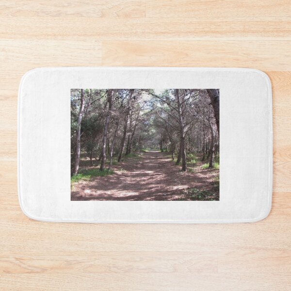 Item preview, Sunlit Forest Path Through Pine Trees And Shaded Woodland Trail With Natural Green Undergrowth designed and sold by Nmallia.