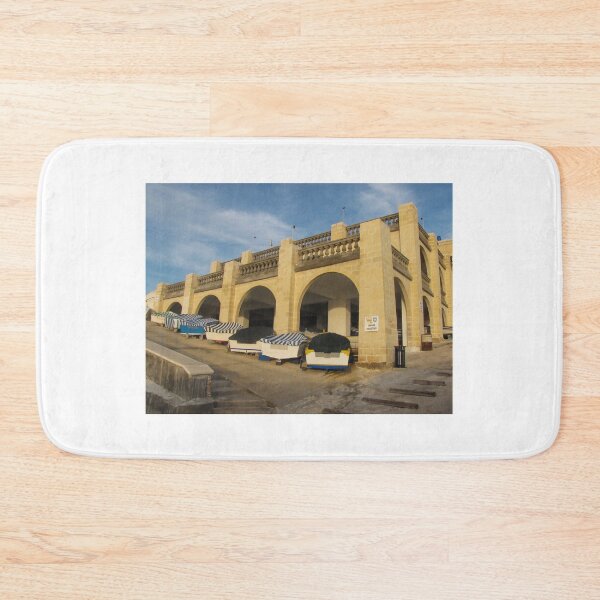 Item preview, Rowboats Stored Under Arched Stone Boathouse With Striped Covers On Sunny Waterfront designed and sold by Nmallia.