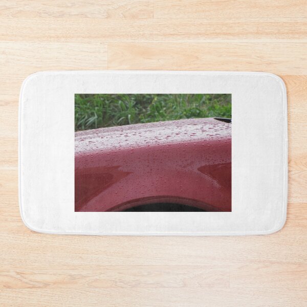 Item preview, Red Car Fender Close-Up With Raindrops on Glossy Paint After Rain Outdoors designed and sold by Nmallia.