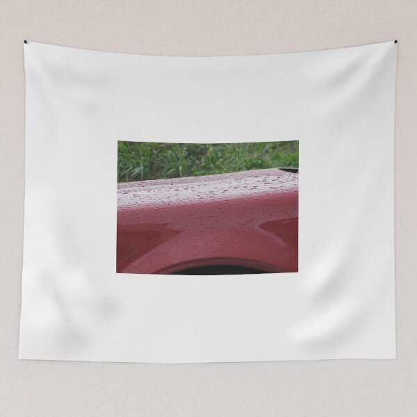 Item preview, Red Car Fender Close-Up With Raindrops on Glossy Paint After Rain Outdoors designed and sold by Nmallia.