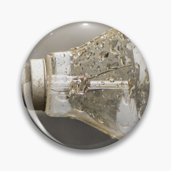 Item preview, Wet Light Bulb Close-Up With Water Droplets On Glass Filament In Vintage Socket designed and sold by Nmallia.