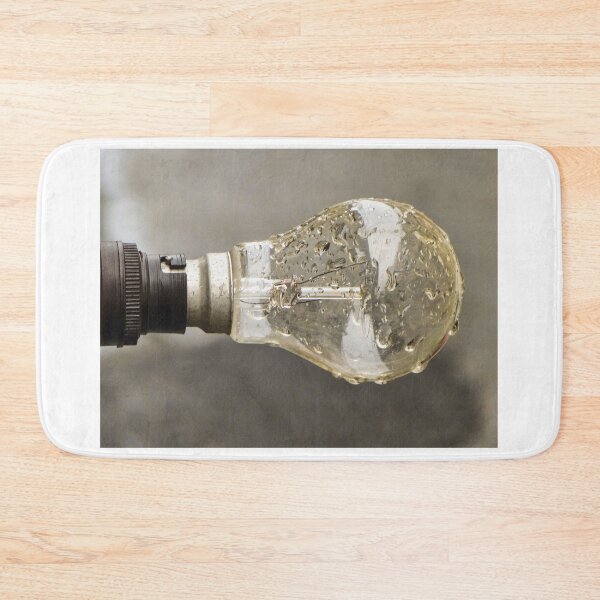 Item preview, Wet Light Bulb Close-Up With Water Droplets On Glass Filament In Vintage Socket designed and sold by Nmallia.