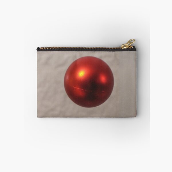 Item preview, Red Christmas Ornament Ball Hanging Against a Soft Neutral Background With Shiny Reflection designed and sold by Nmallia.