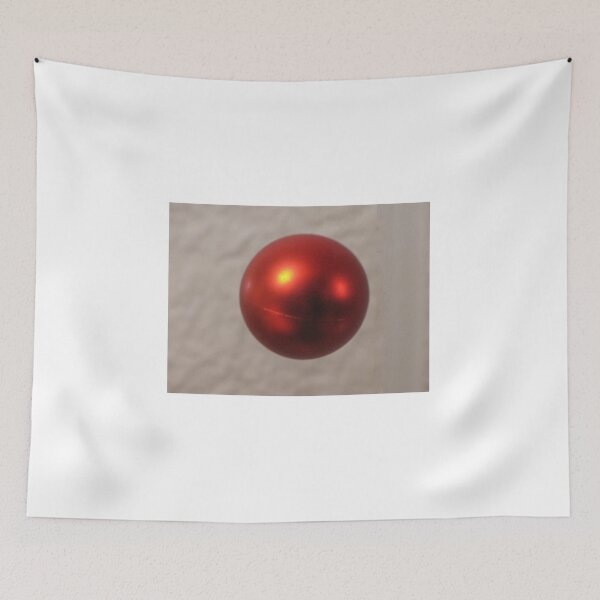 Item preview, Red Christmas Ornament Ball Hanging Against a Soft Neutral Background With Shiny Reflection designed and sold by Nmallia.