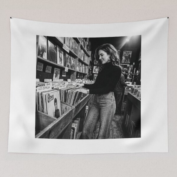 Item preview, Young Woman Browsing Vintage Vinyl Records in Store designed and sold by NiceArtsPlace.