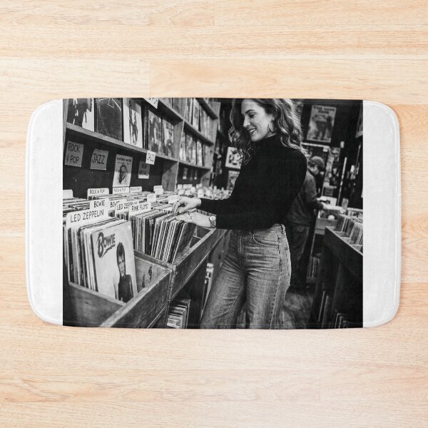 Item preview, Young Woman Browsing Vintage Vinyl Records in Store designed and sold by NiceArtsPlace.