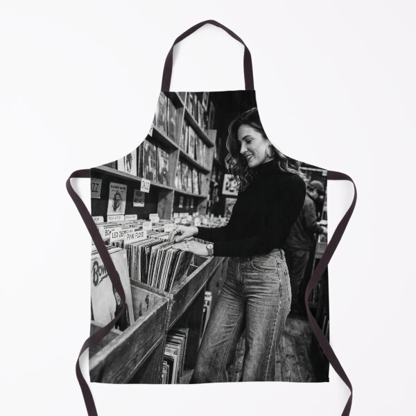 Item preview, Young Woman Browsing Vintage Vinyl Records in Store designed and sold by NiceArtsPlace.