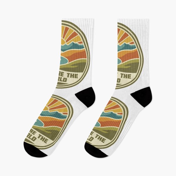 Item preview, Vintagestyle circular emblem featuring a vibrant sunrise over mountains and river with the text explore the world designed and sold by Robo-toons.