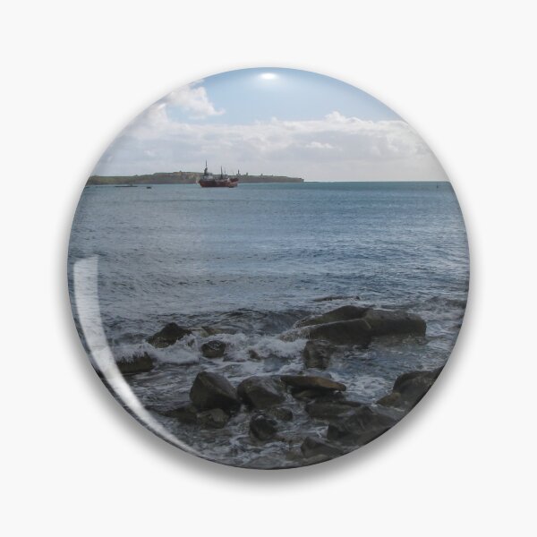 Item preview, Calm Rocky Shoreline Overlooking Cargo Ship and Industrial Port Under Cloudy Sky designed and sold by Nmallia.