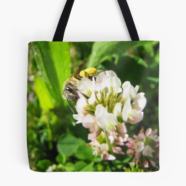 Item preview, Honeybee Collecting Pollen On White Clover Flower In Sunny Green Meadow Close-Up designed and sold by Nmallia.