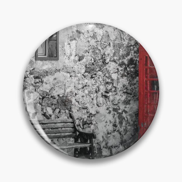 Item preview, Red Telephone Box and Empty Bench Against Weathered Stone Wall in Selective Color Photograph designed and sold by Nmallia.