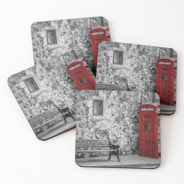 Item preview, Red Telephone Box and Empty Bench Against Weathered Stone Wall in Selective Color Photograph designed and sold by Nmallia.