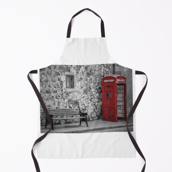 Item preview, Red Telephone Box and Empty Bench Against Weathered Stone Wall in Selective Color Photograph designed and sold by Nmallia.