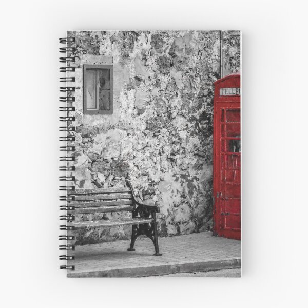 Item preview, Red Telephone Box and Empty Bench Against Weathered Stone Wall in Selective Color Photograph designed and sold by Nmallia.