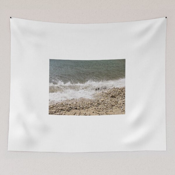 Item preview, Pebble Beach Shoreline With Breaking Waves and Rocky Coastline On A Calm Sea designed and sold by Nmallia.