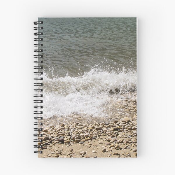Item preview, Pebble Beach Shoreline With Breaking Waves and Rocky Coastline On A Calm Sea designed and sold by Nmallia.