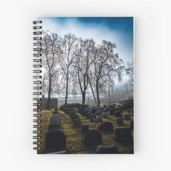 Item preview, Dramatic light from sun through dens fog under bright blue sky over graveyard  designed and sold by AB Photostudio.