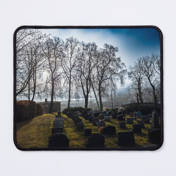 Item preview, Dramatic light from sun through dens fog under bright blue sky over graveyard designed and sold by AB Photostudio.