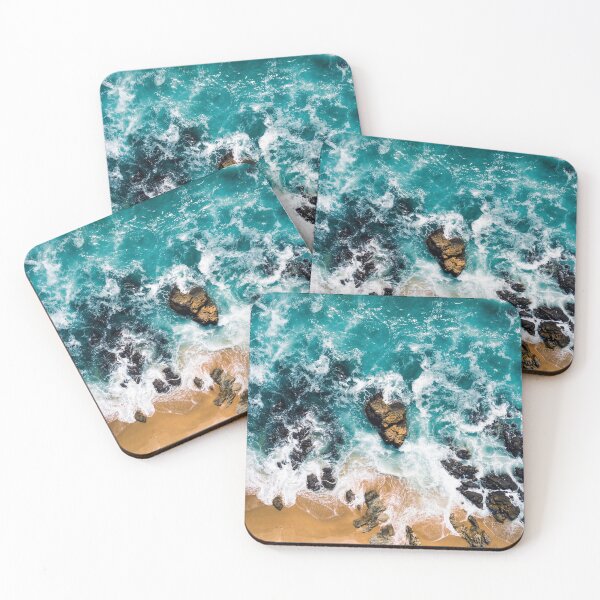 Item preview, Breathtaking aerial view: Turquoise ocean waves break on a rocky sandy beach designed and sold by StillOravisuals.