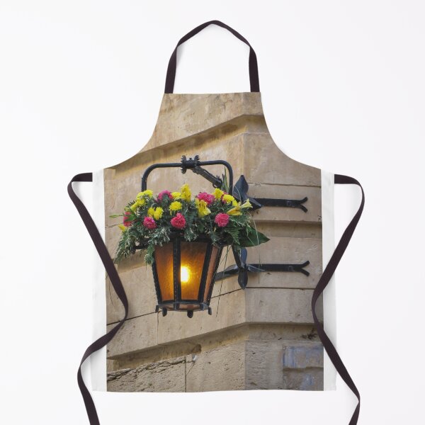 Item preview, Vintage Wall Lantern With Bright Floral Arrangement Hanging On A Stone Street Corner designed and sold by Nmallia.