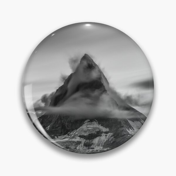 Item preview, Snowcapped Matterhorn peak in the clouds at sunrise, Zermatt, Switzerland black and white photographic art print designed and sold by Astrid Arkhangelsky.