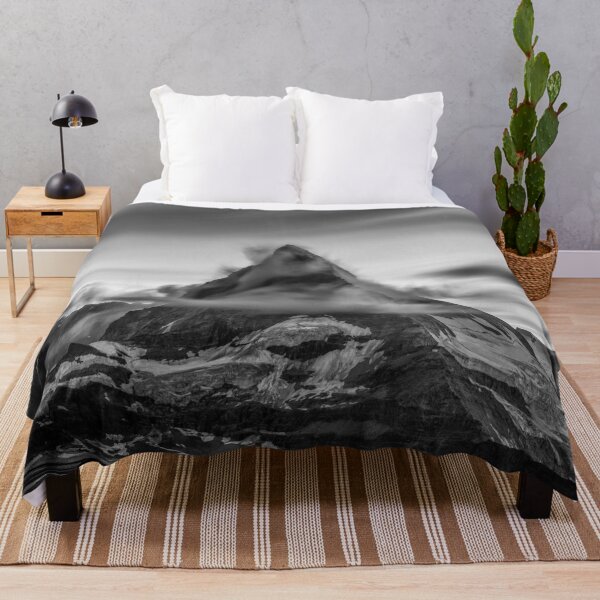 Item preview, Snowcapped Matterhorn peak in the clouds at sunrise, Zermatt, Switzerland black and white photographic art print designed and sold by Astrid Arkhangelsky.