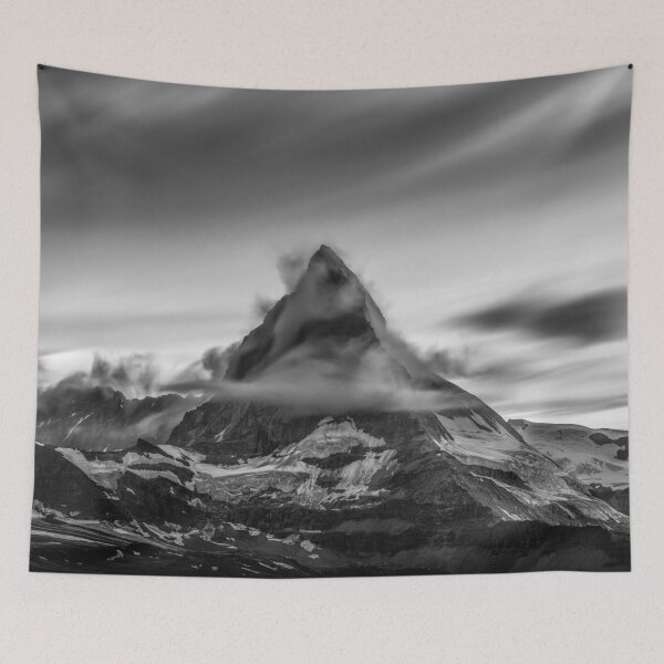 Item preview, Snowcapped Matterhorn peak in the clouds at sunrise, Zermatt, Switzerland black and white photographic art print designed and sold by Astrid Arkhangelsky.