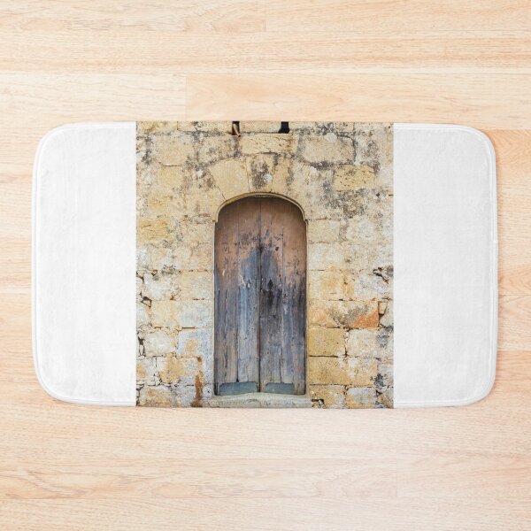 Item preview, Weathered Wooden Door Set in Old Stone Wall With Arched Entrance and Rustic Texture designed and sold by Nmallia.