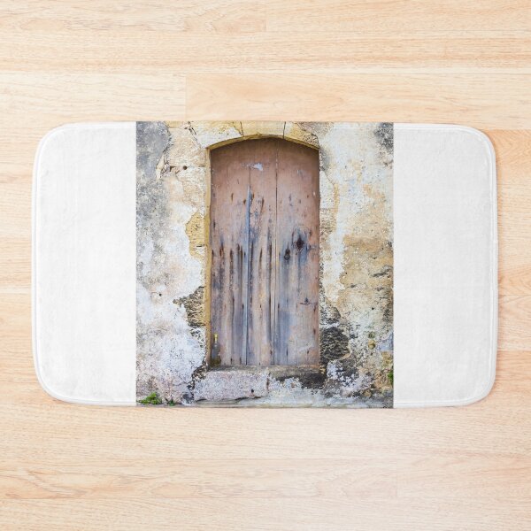 Item preview, Weathered Wooden Door Set in Old Stone Wall With Arched Entrance and Rustic Texture designed and sold by Nmallia.