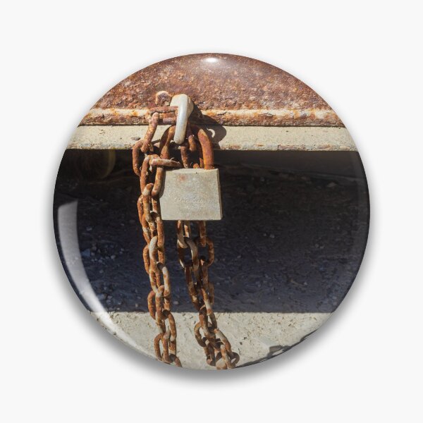 Item preview, Rusty Metal Padlock and Chain Hanging From Corroded Door Panel With Textured Surface designed and sold by Nmallia.