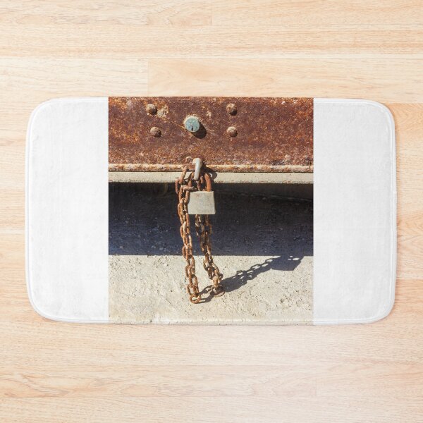 Item preview, Rusty Metal Padlock and Chain Hanging From Corroded Door Panel With Textured Surface designed and sold by Nmallia.