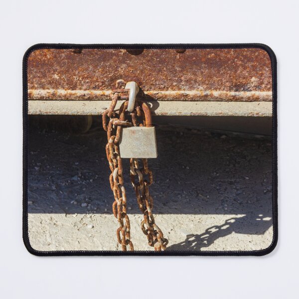 Item preview, Rusty Metal Padlock and Chain Hanging From Corroded Door Panel With Textured Surface designed and sold by Nmallia.